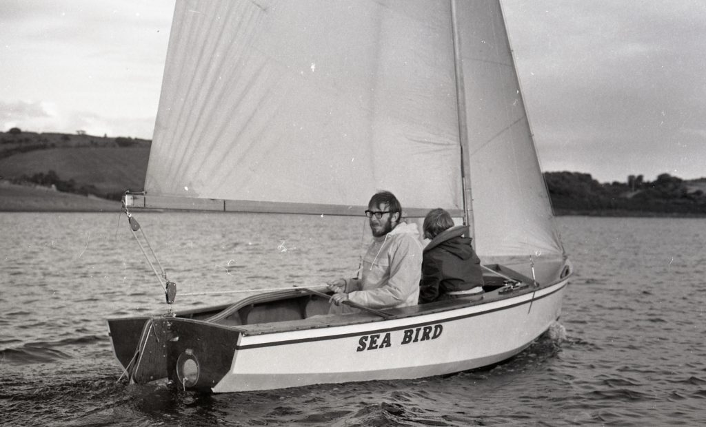 A close up of 'Sea Bird' and her crew out on the waters of Siblyback Lake, August 1970